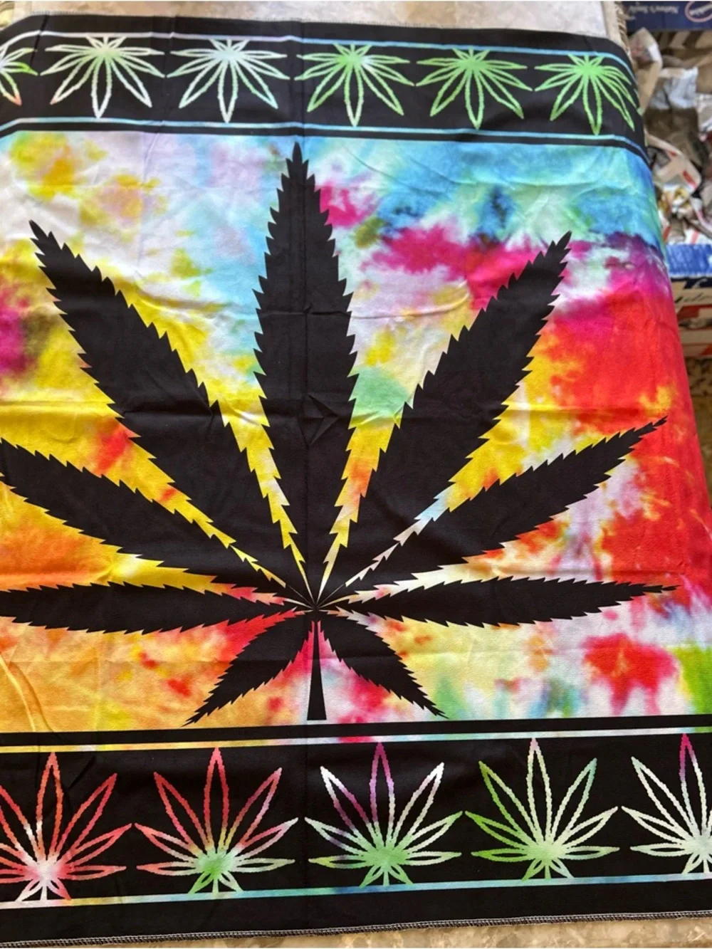 Tie-Dye Cannabis Leaf  - Vibrant Rainbow. Size is. 60” long. 40”. Wide.